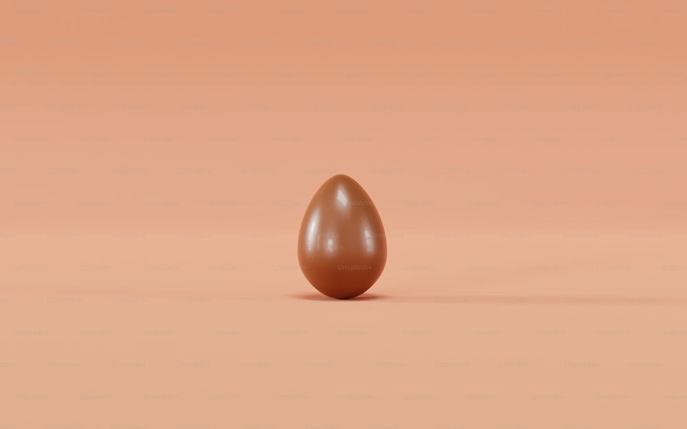 a brown egg sitting on top of a table