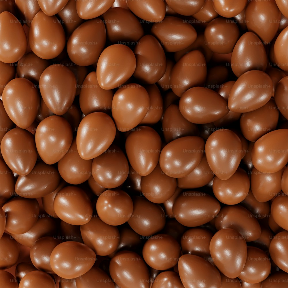 a large pile of chocolate covered almonds