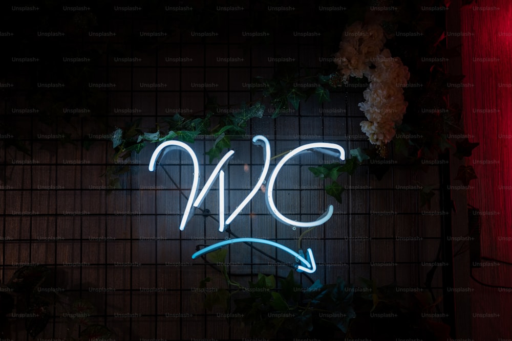 a neon sign that reads n c on a wall