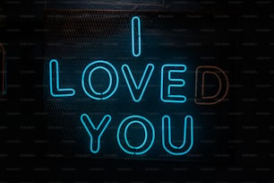 a neon sign that says i loved you