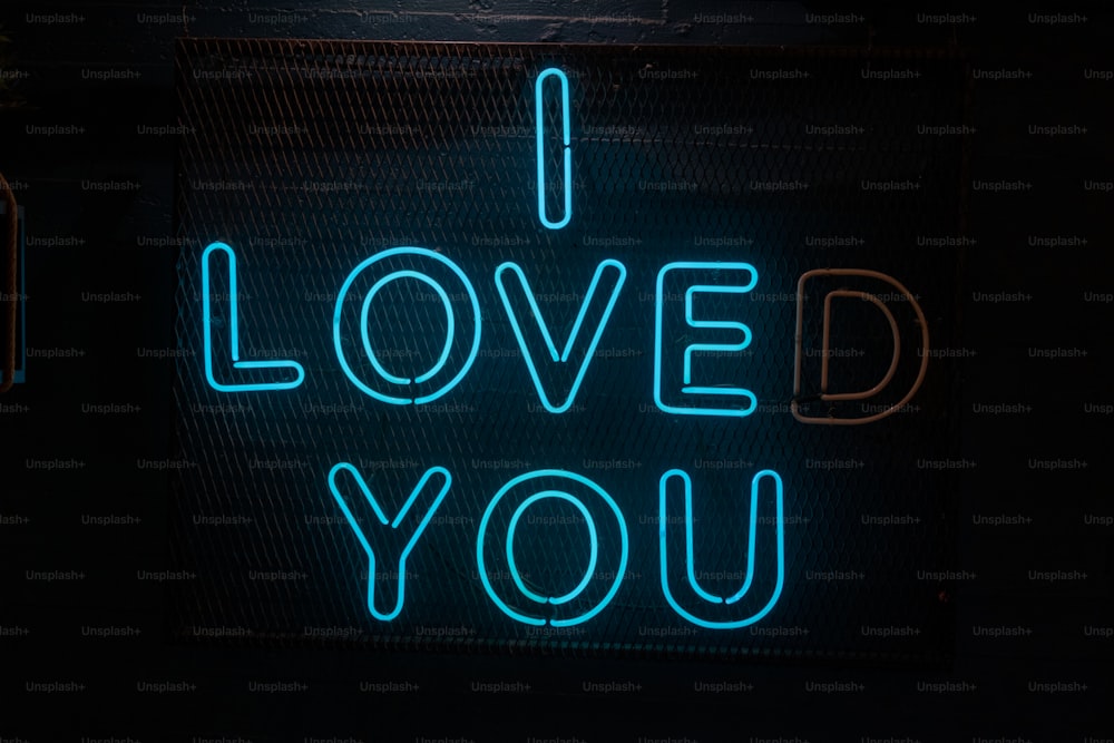 a neon sign that says i loved you