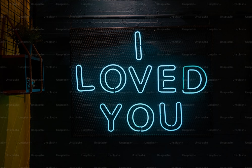 a neon sign that says i loved you