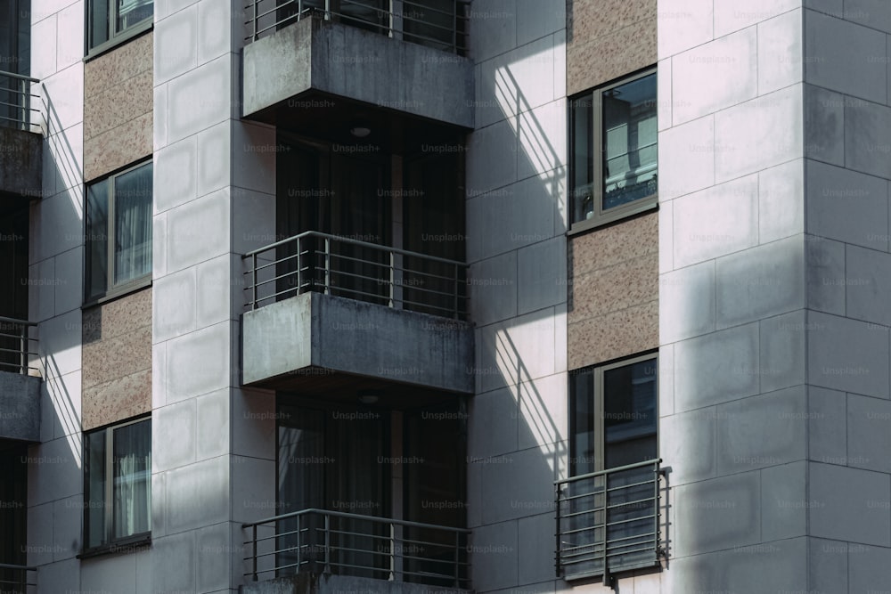 a clock on a pole in front of a building