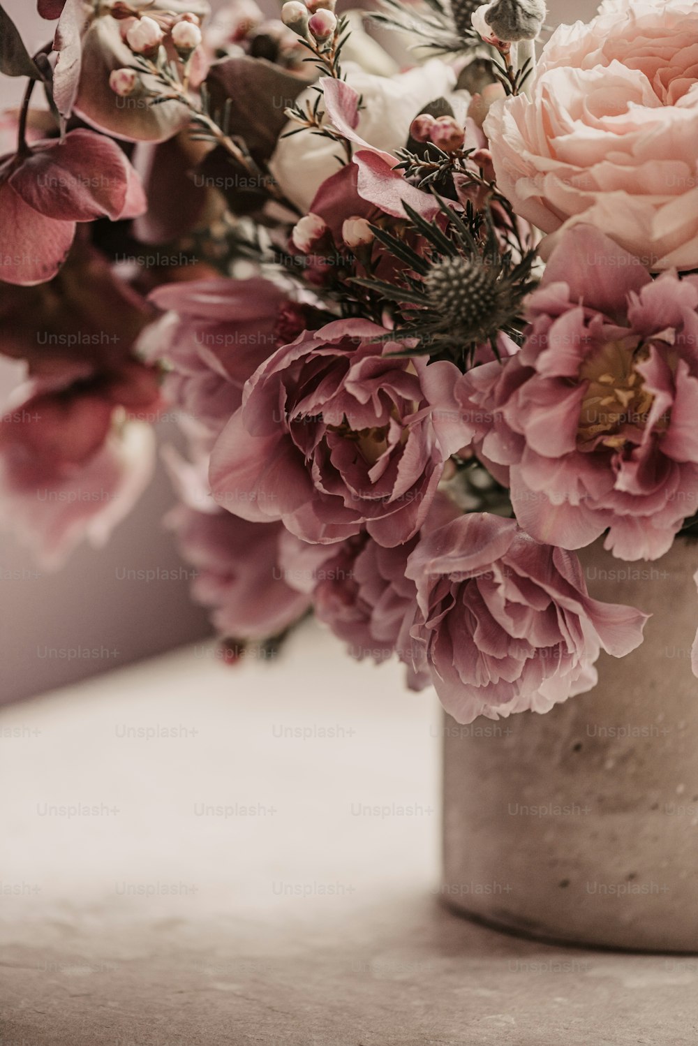 a bunch of flowers in a vase on a table