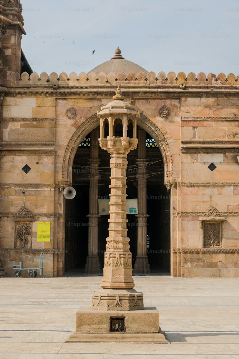 a tall clock tower sitting in front of a building