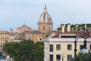 a view of a city with a church in the background