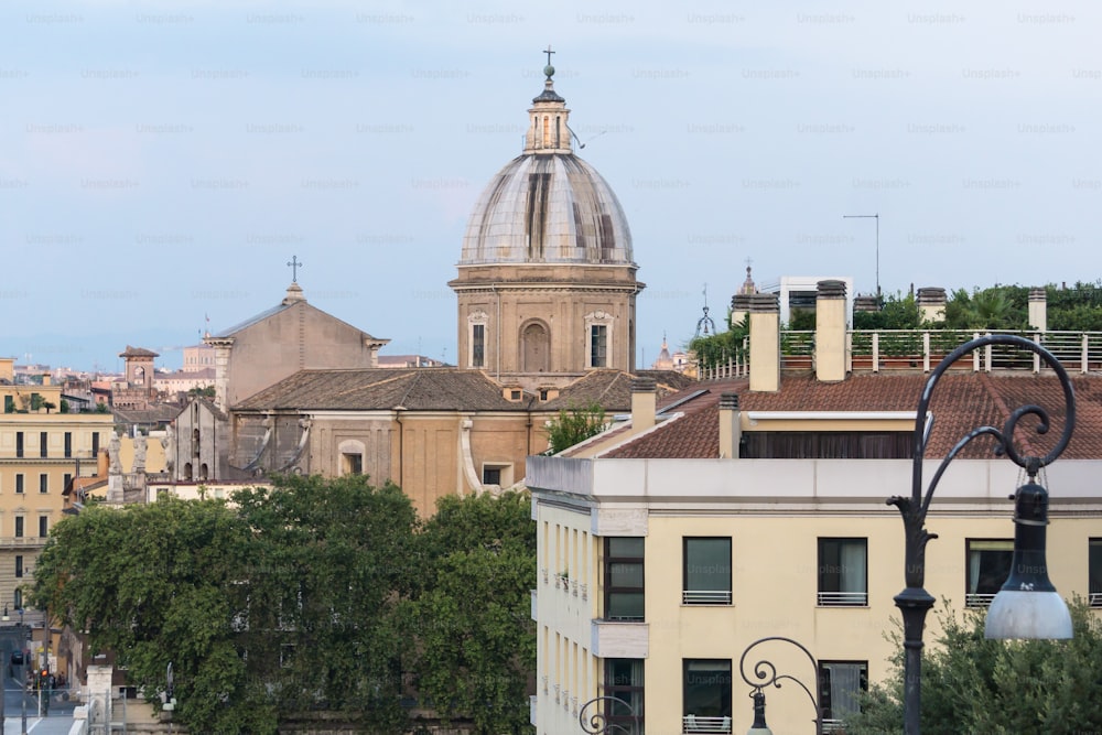 a view of a city with a church in the background