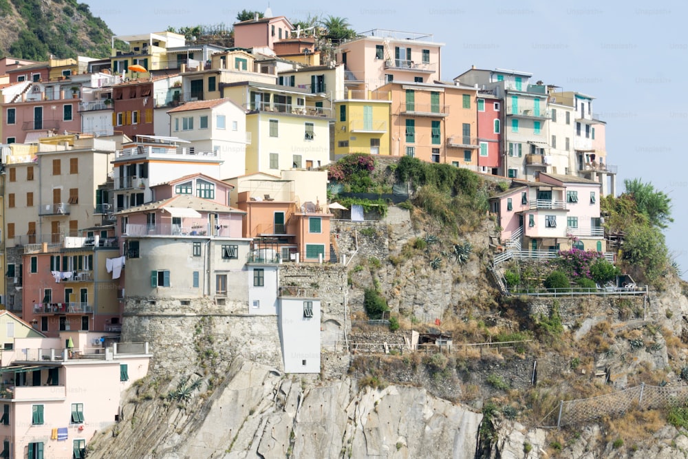 a group of buildings on top of a cliff