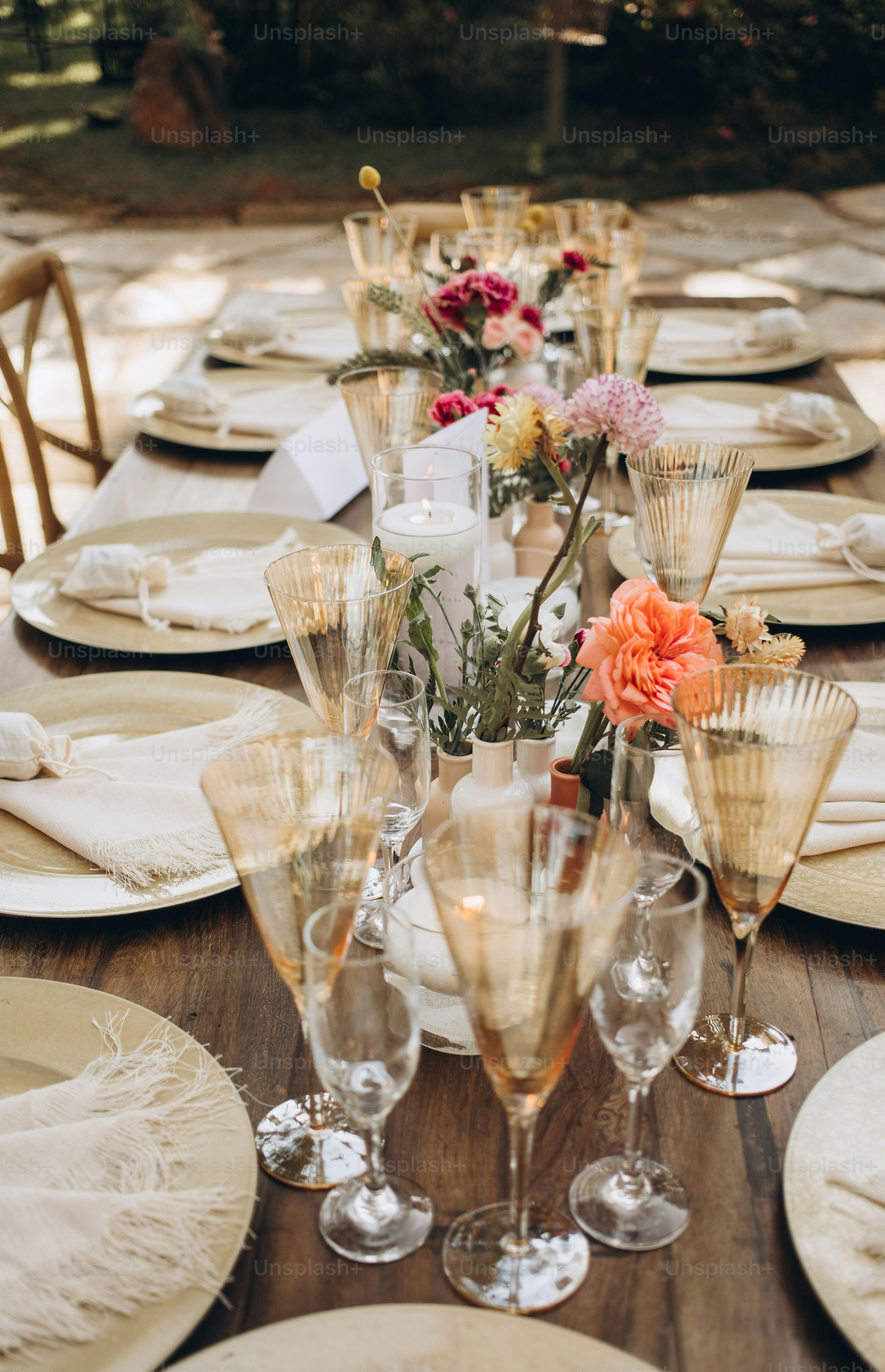 A table set for a formal dinner with wine glasses and napkins photo ...