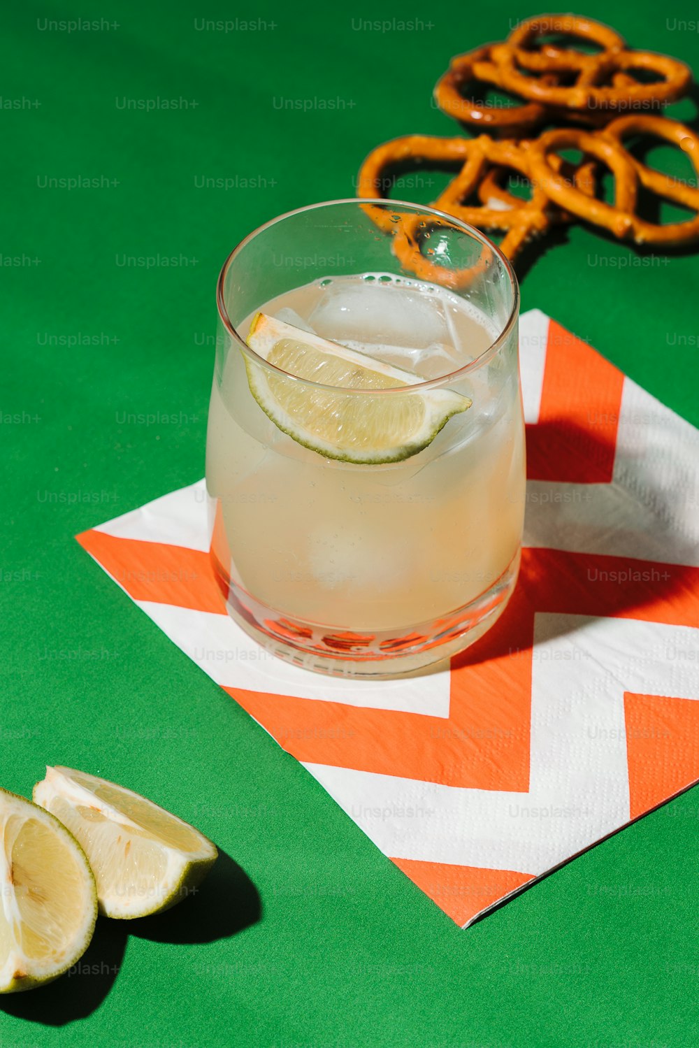 a drink with a slice of lemon on a napkin