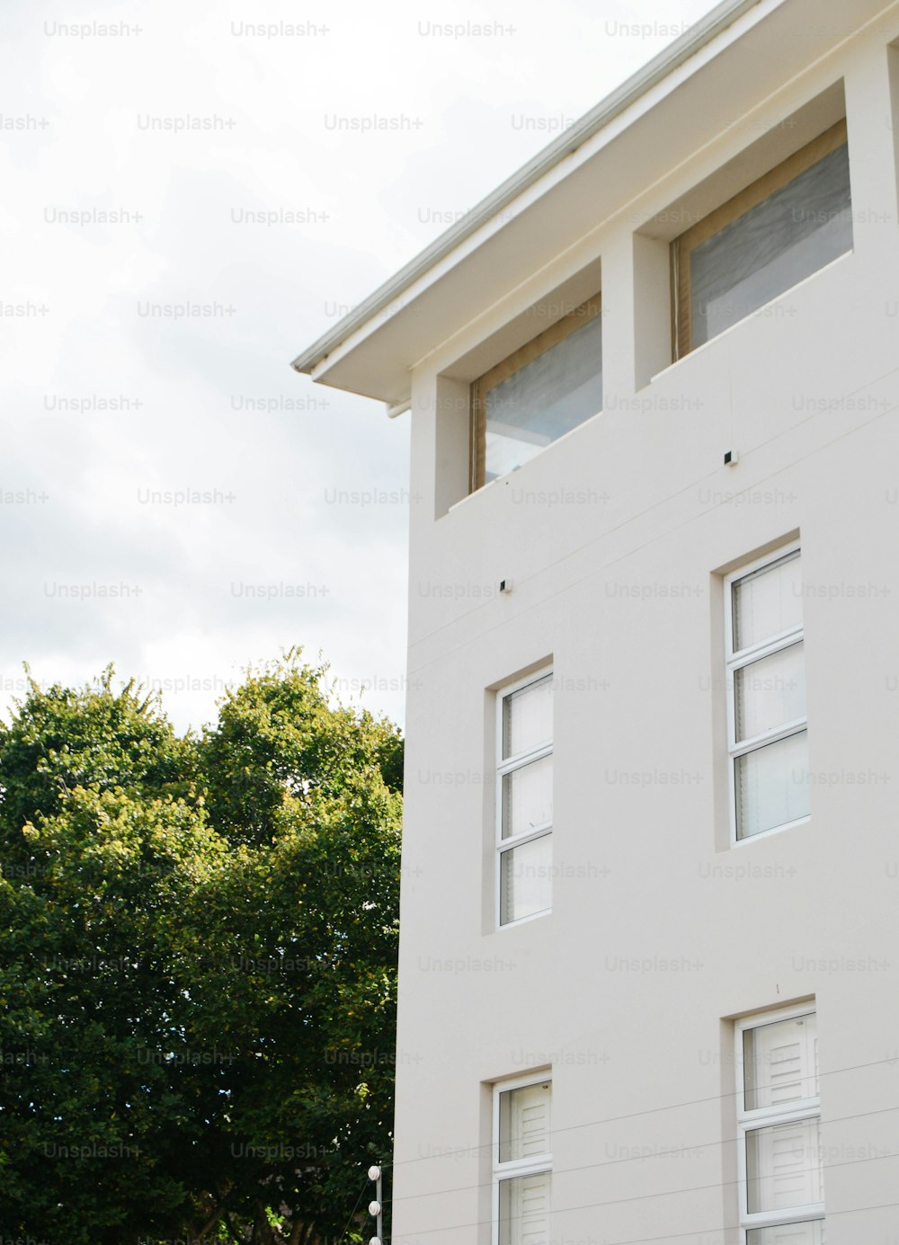 a white building with a clock on the front of it