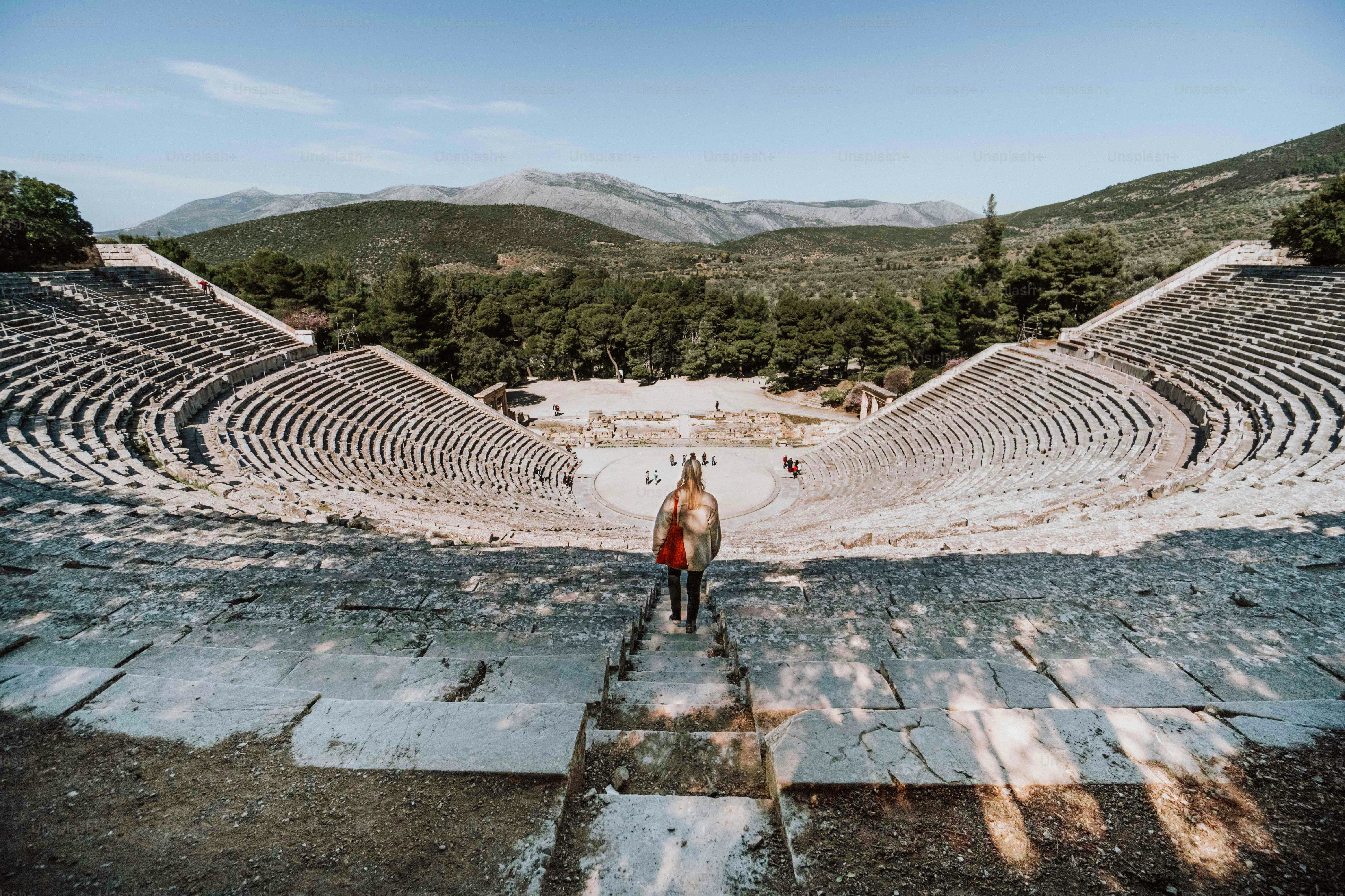 a horse standing in front of a stone ampule