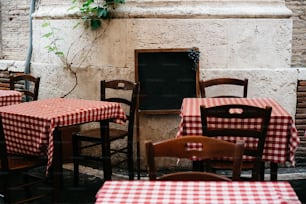 a restaurant with red and white checkered tables and chairs