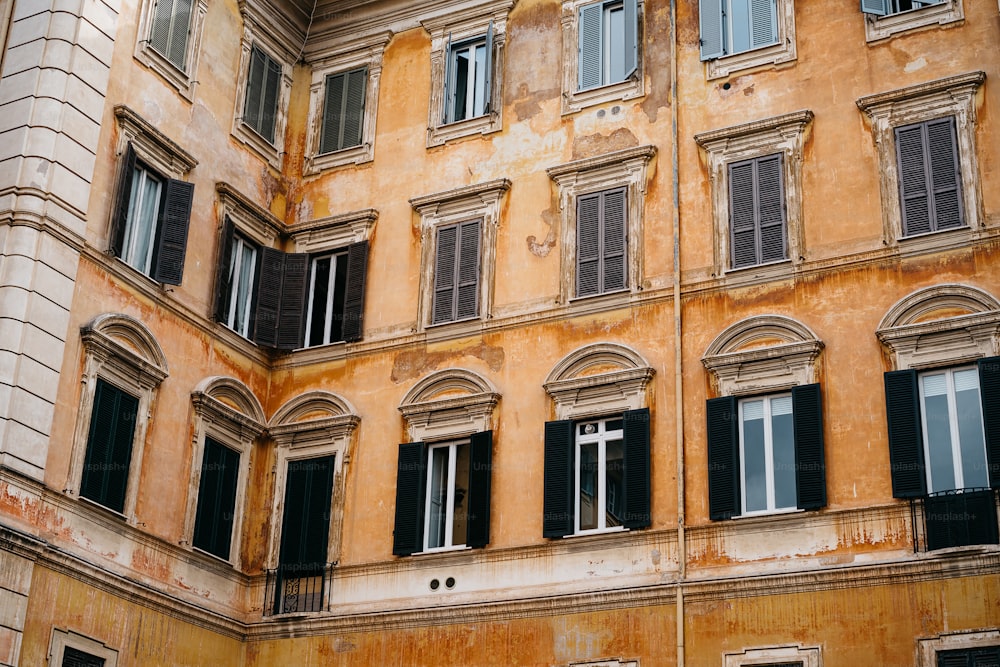 an old building with many windows and a clock