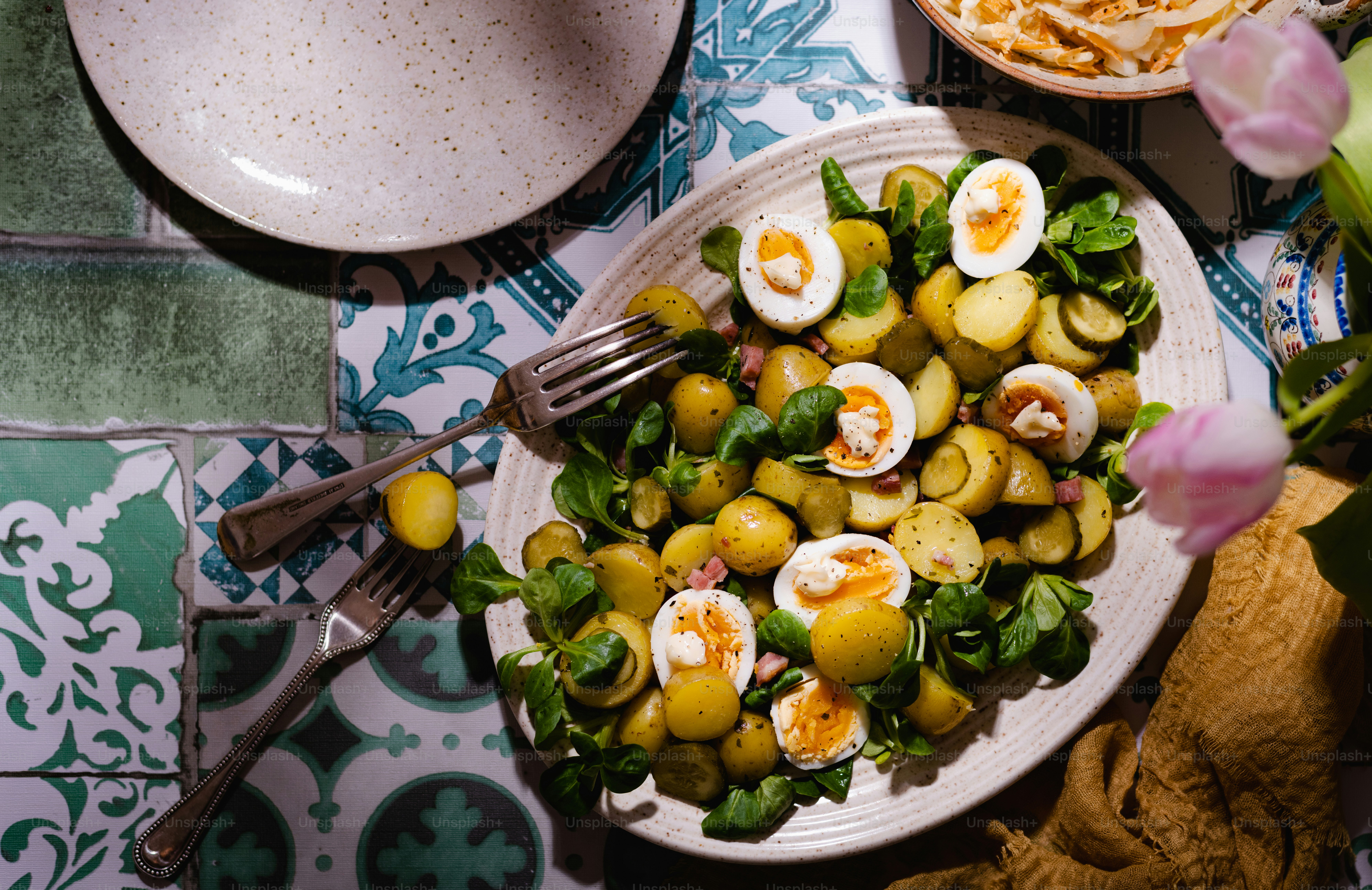 a plate of food with eggs and spinach