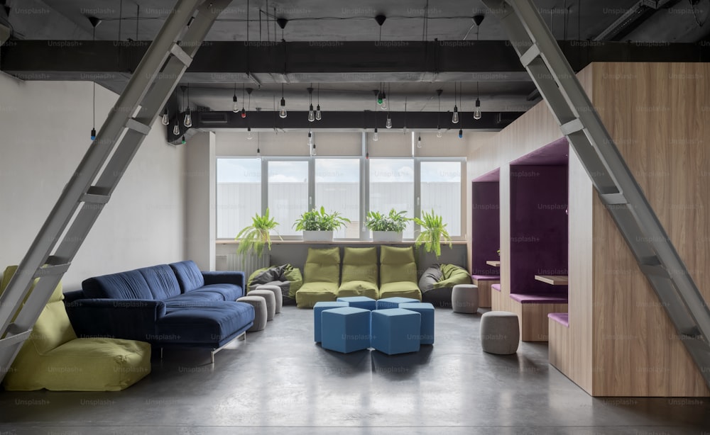 a living room filled with furniture and lots of windows