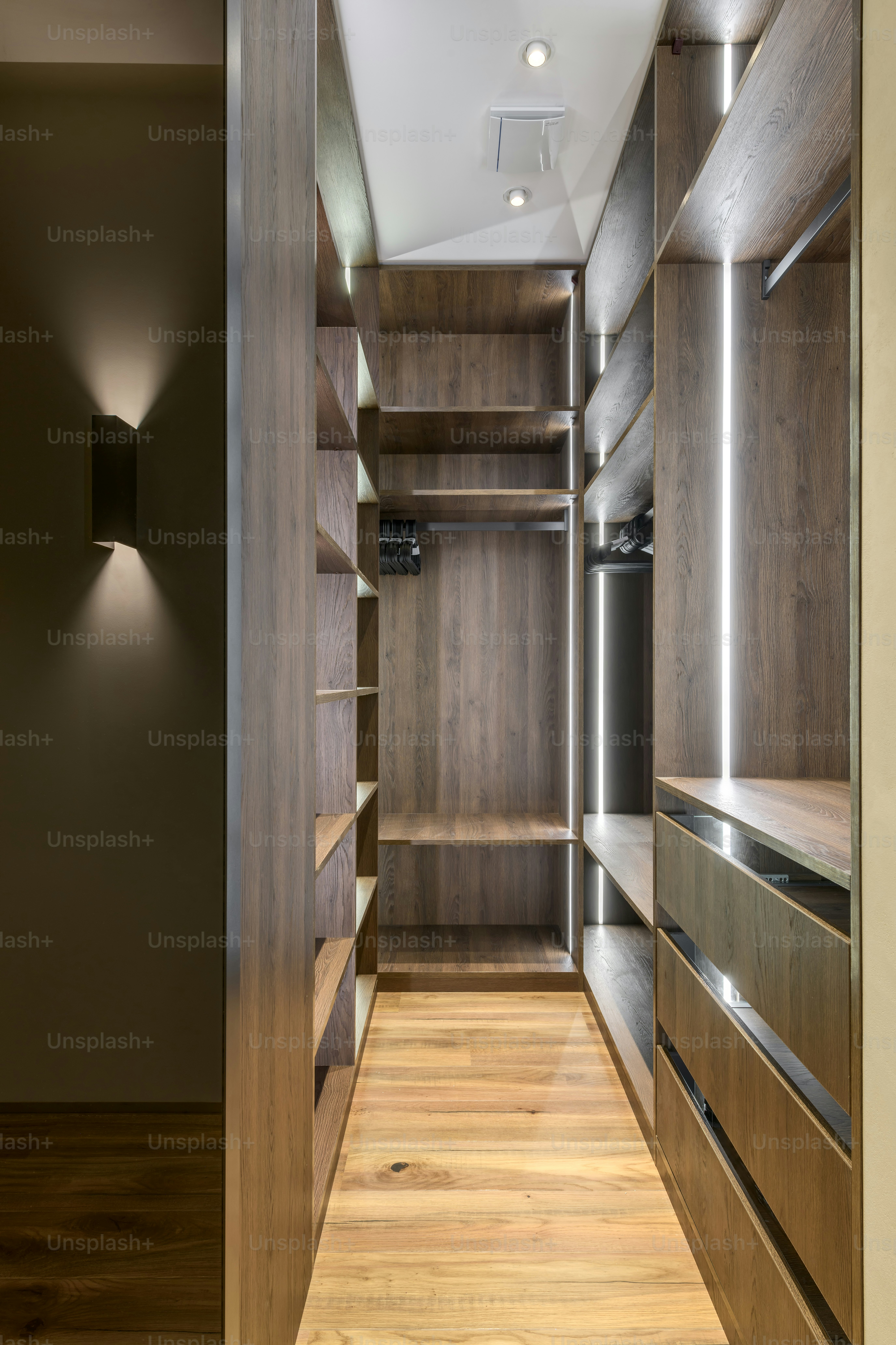 a very long and narrow walk in closet