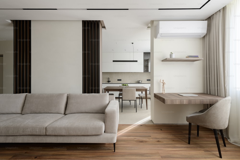 a living room with a couch a table and chairs