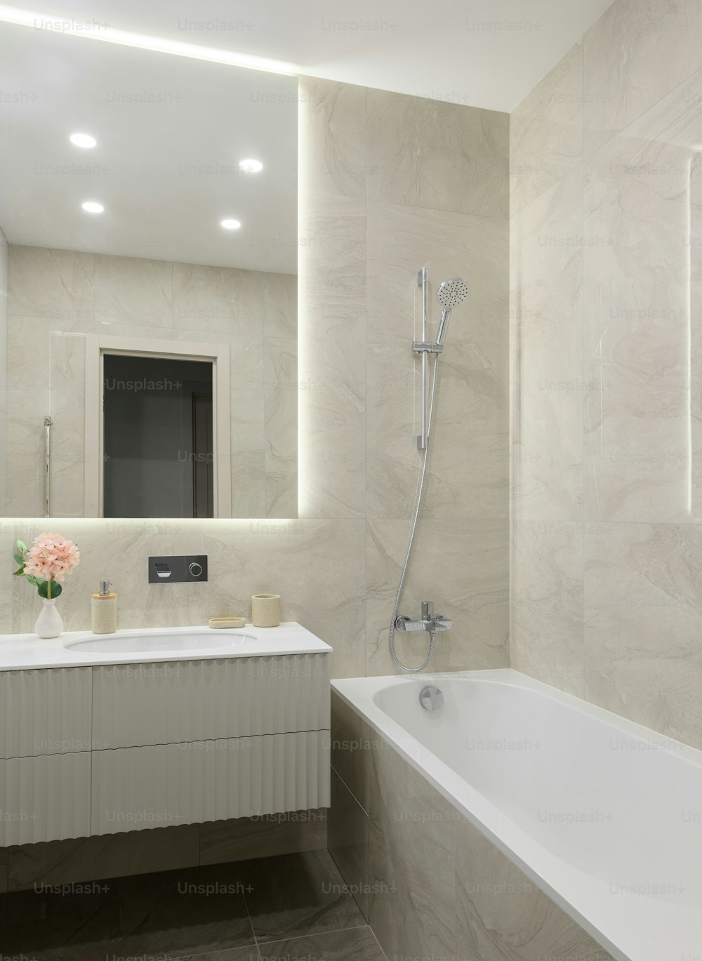 a bathroom with a tub, sink and mirror