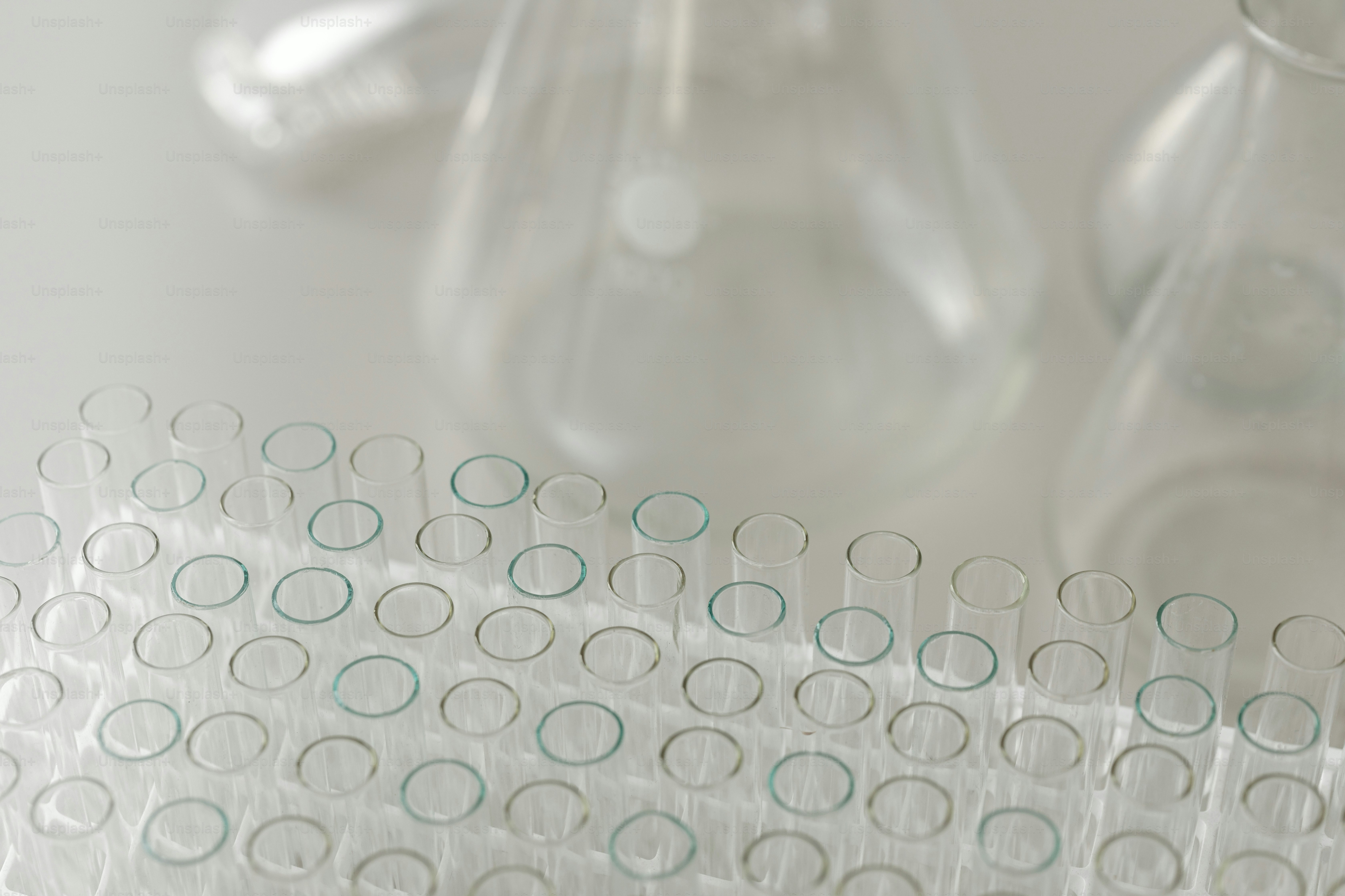 a group of glass vases sitting on top of a table