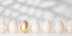 a row of eggs with a golden egg in the middle