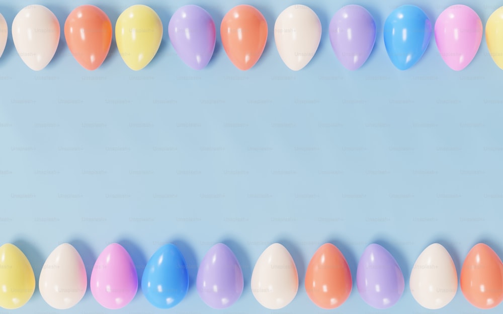 a row of pastel colored balloons on a blue background
