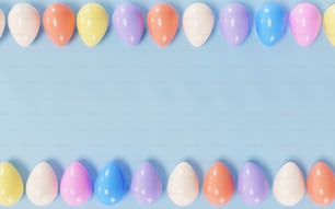 a row of pastel colored balloons on a blue background