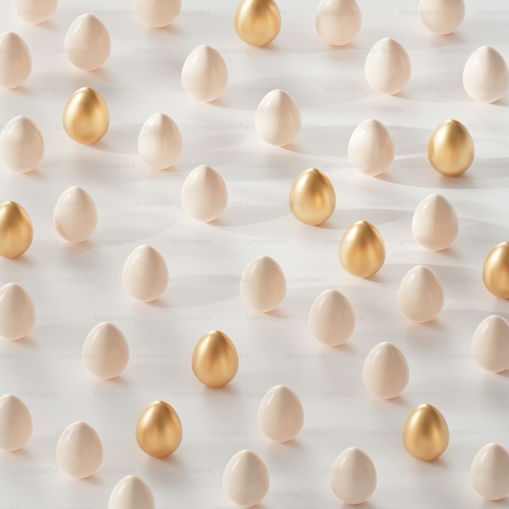a group of white and gold balls on a white surface