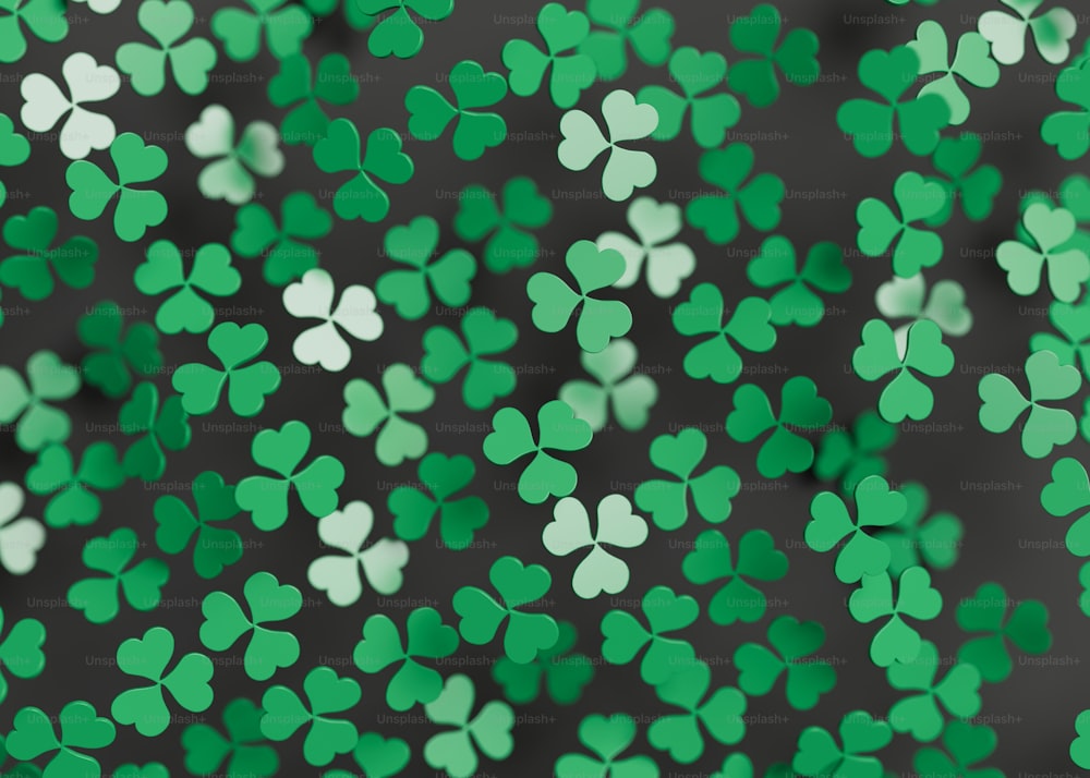 a bunch of green shamrocks that are flying in the air