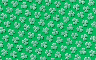 a green background with white shamrocks on it