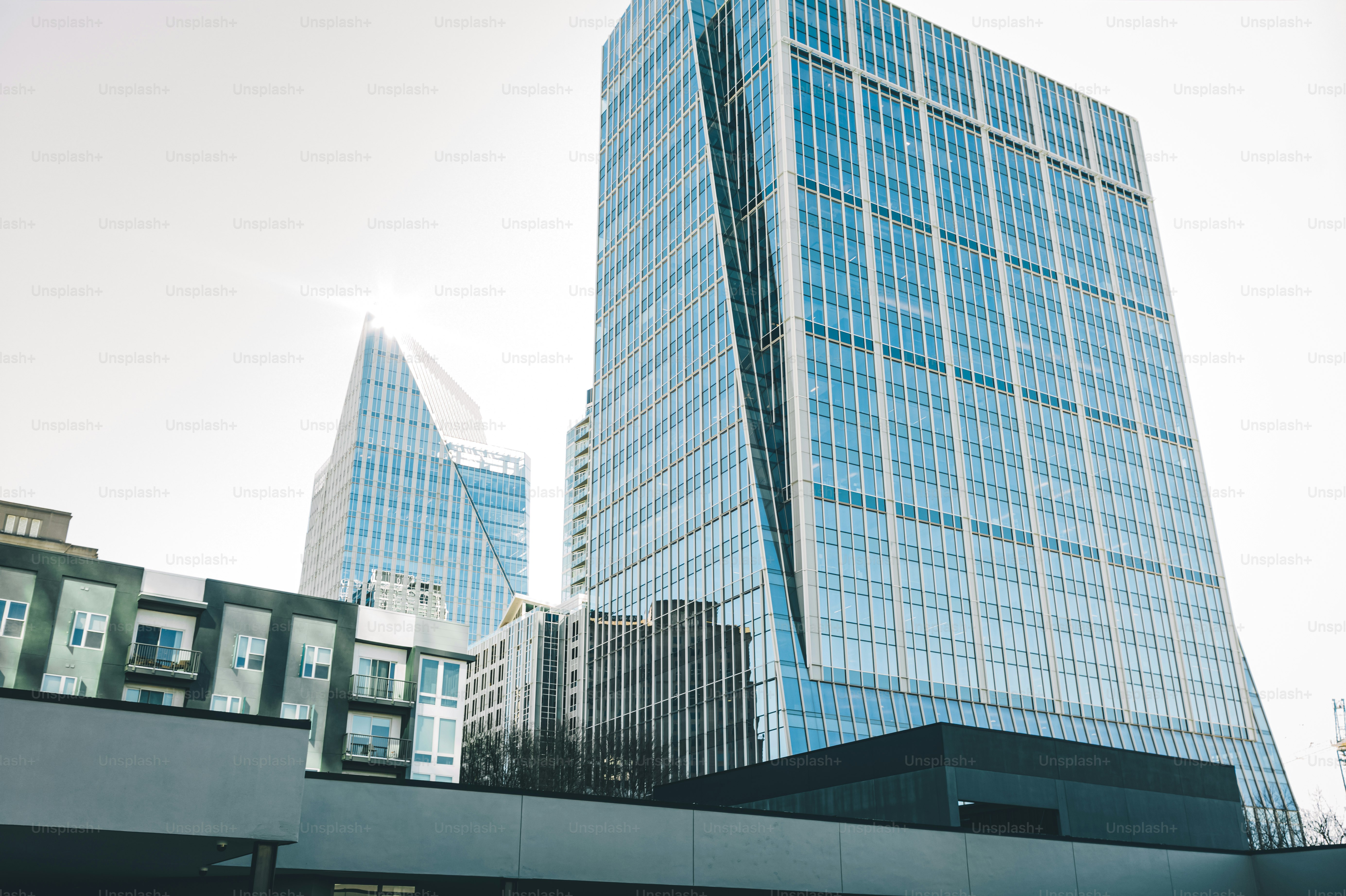 a very tall building sitting next to other tall buildings