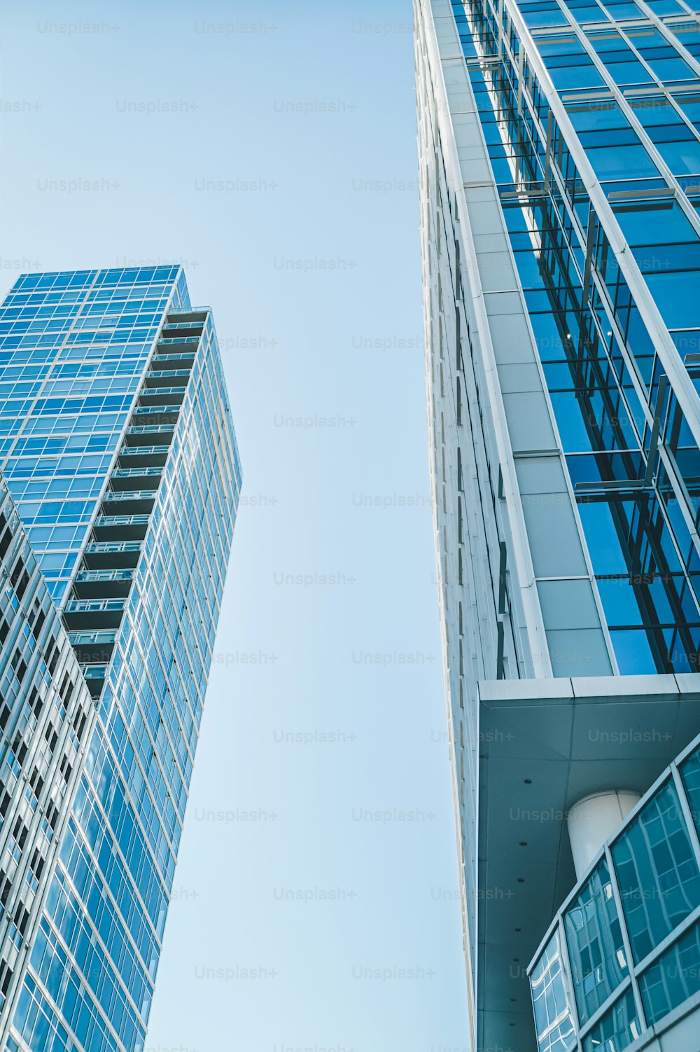 a couple of tall buildings sitting next to each other