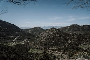 a scenic view of mountains and a road