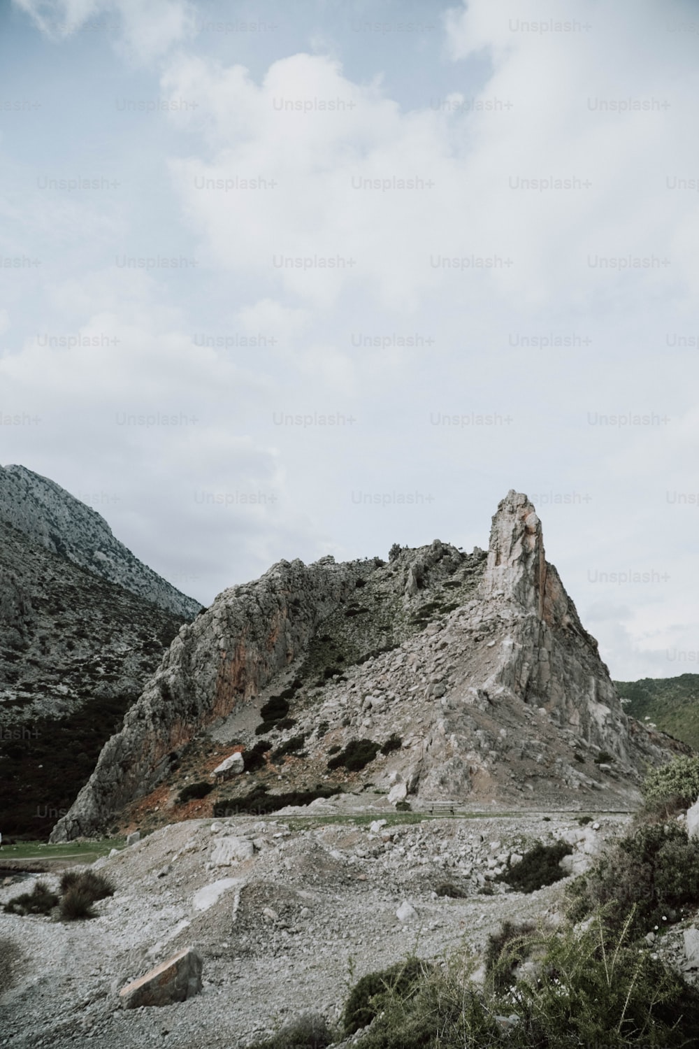 a mountain with a very tall rock on top of it