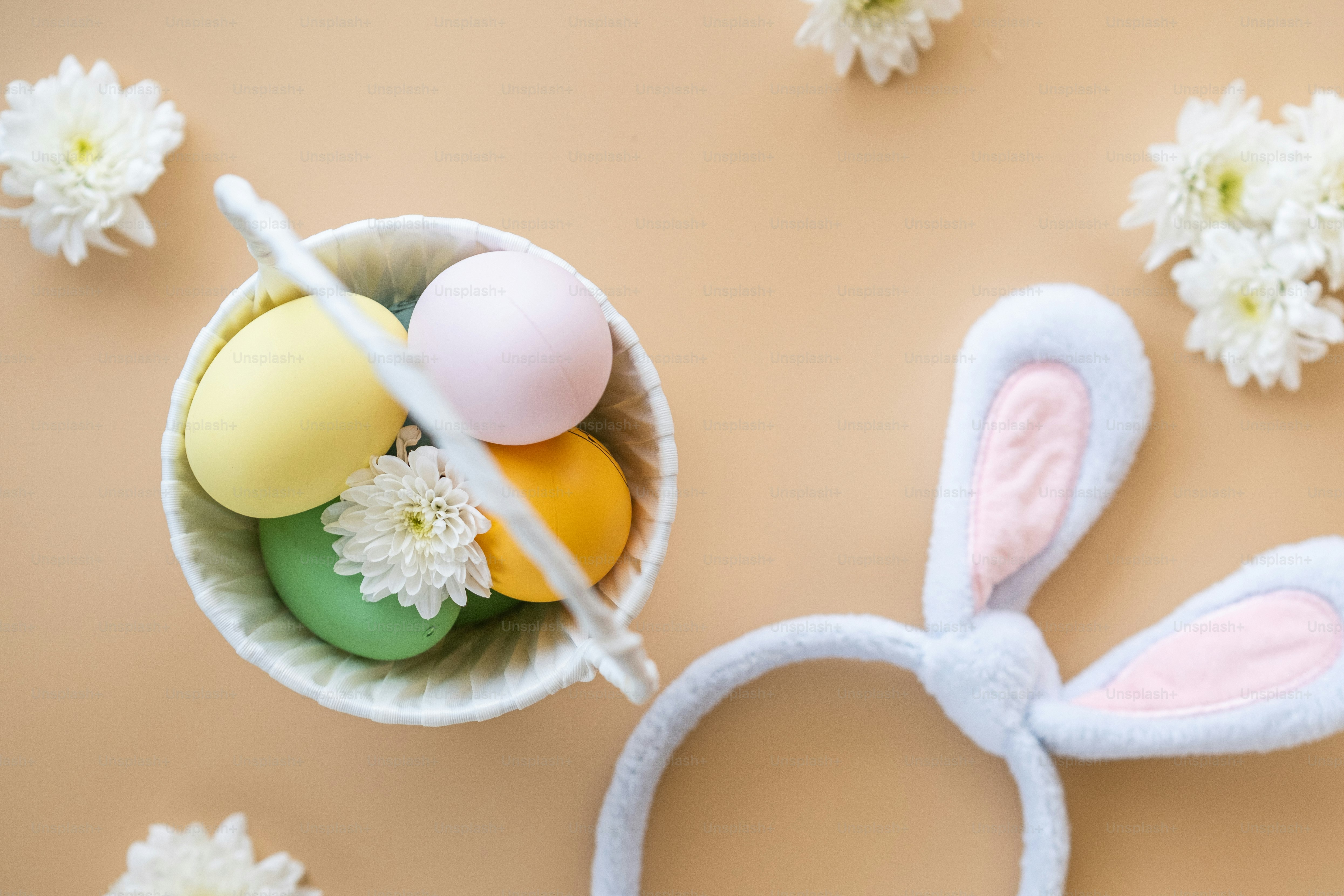 a bowl of eggs and a pair of bunny ears