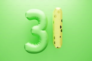 a number three and a piece of cheese on a green background