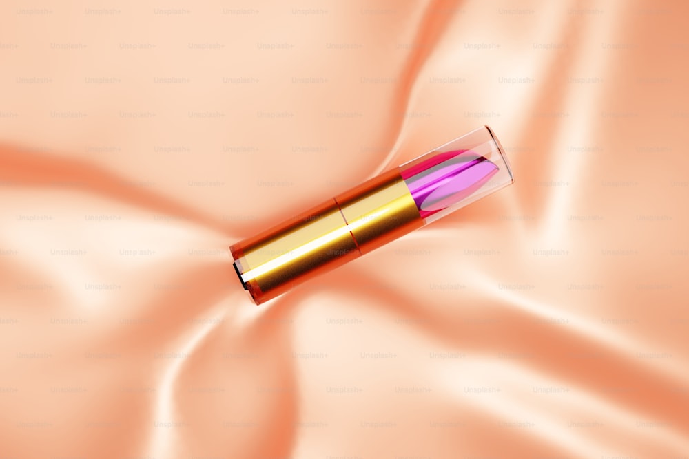 a close up of a lipstick on a satin surface