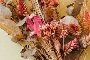 a bunch of dried flowers sitting on top of a table