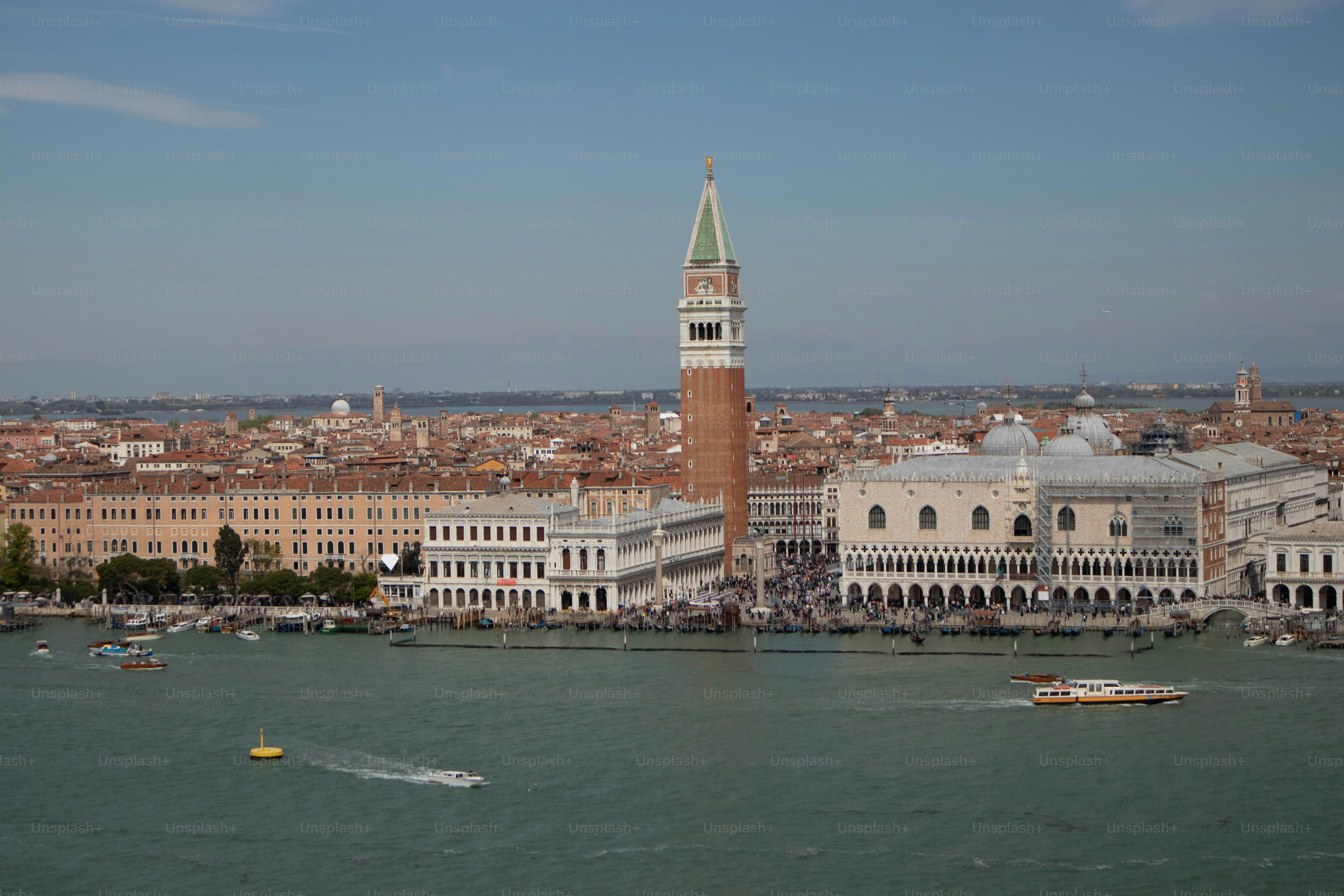 a large body of water with a city in the background