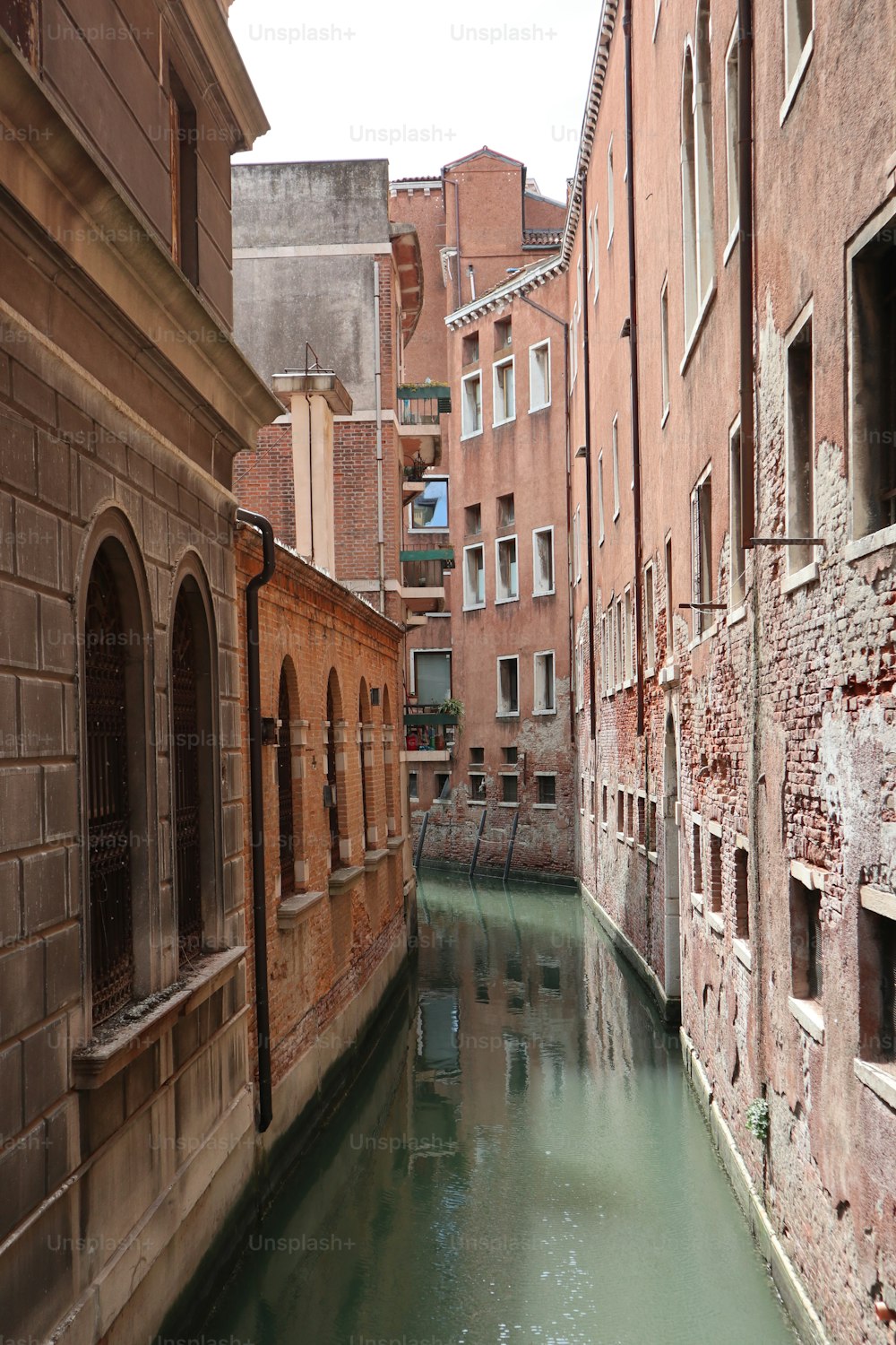 a narrow canal running between two buildings in a city