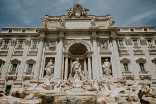 a large building with a fountain in front of it