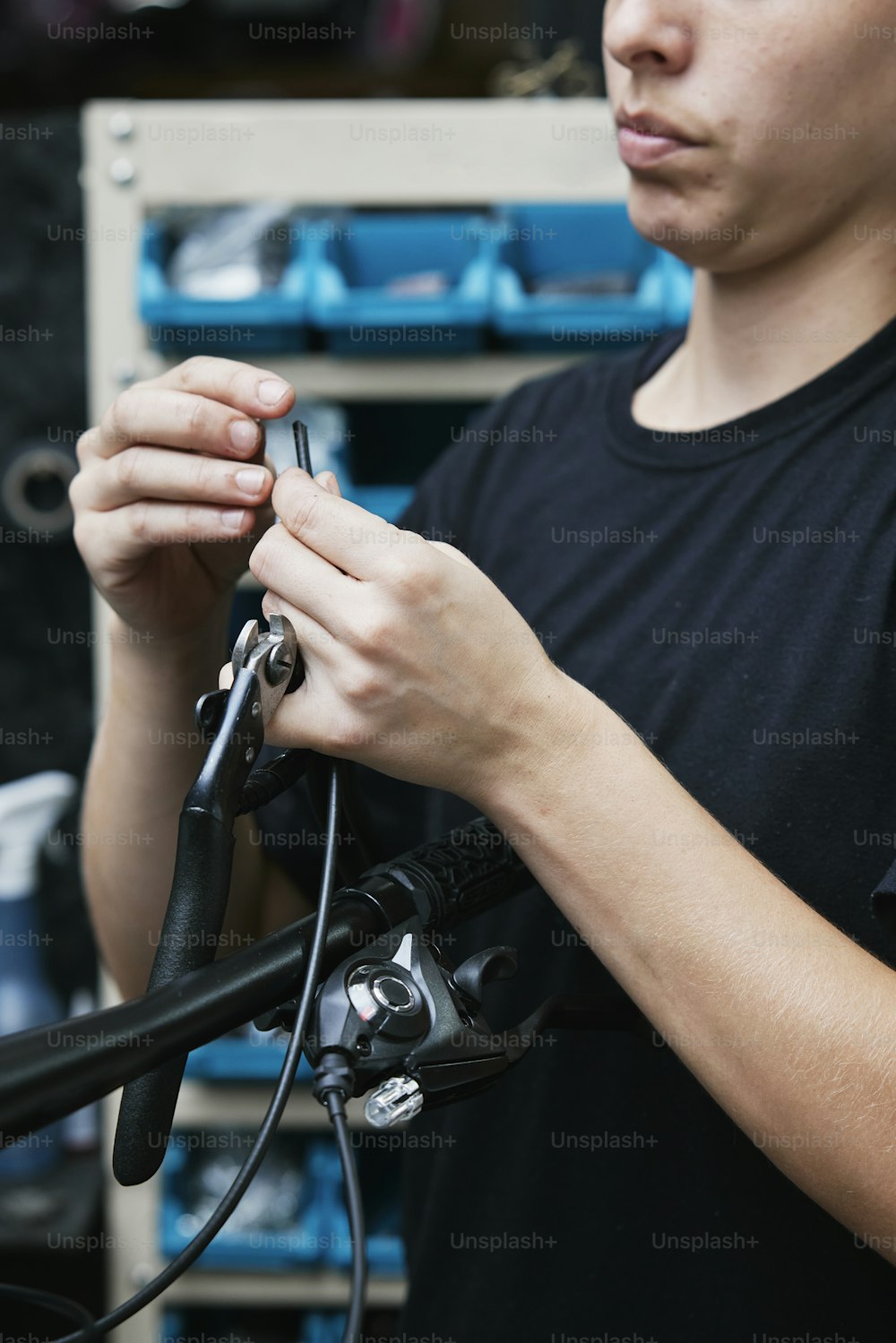 a man working on a bicycle in a shop