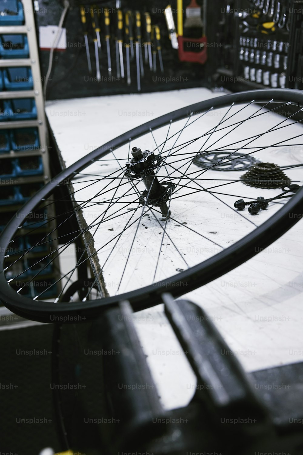 a bicycle wheel is shown in the reflection of a mirror