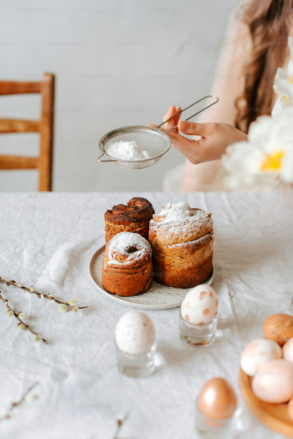 a table topped with pastries and eggs