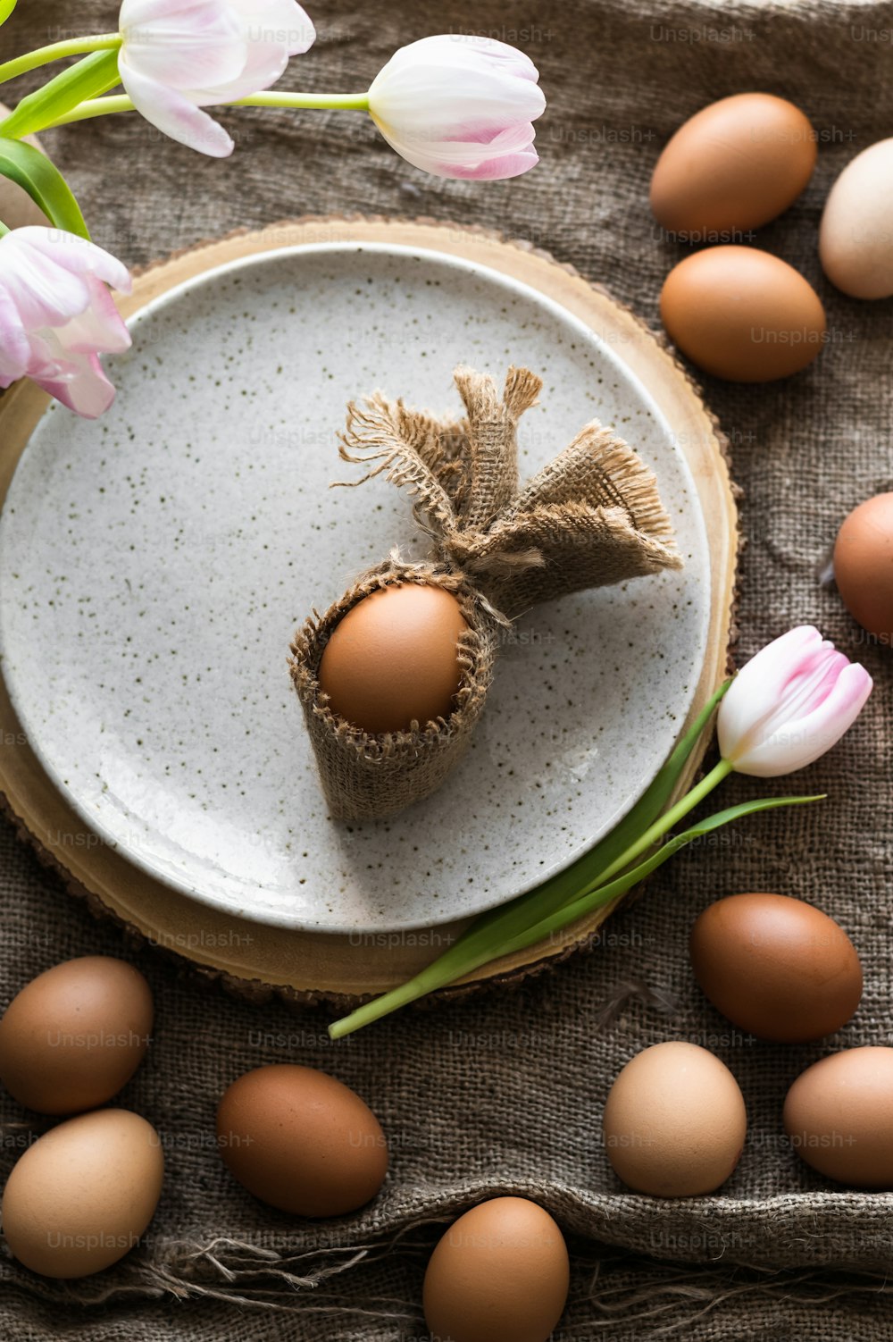 a plate with some eggs on it next to some flowers