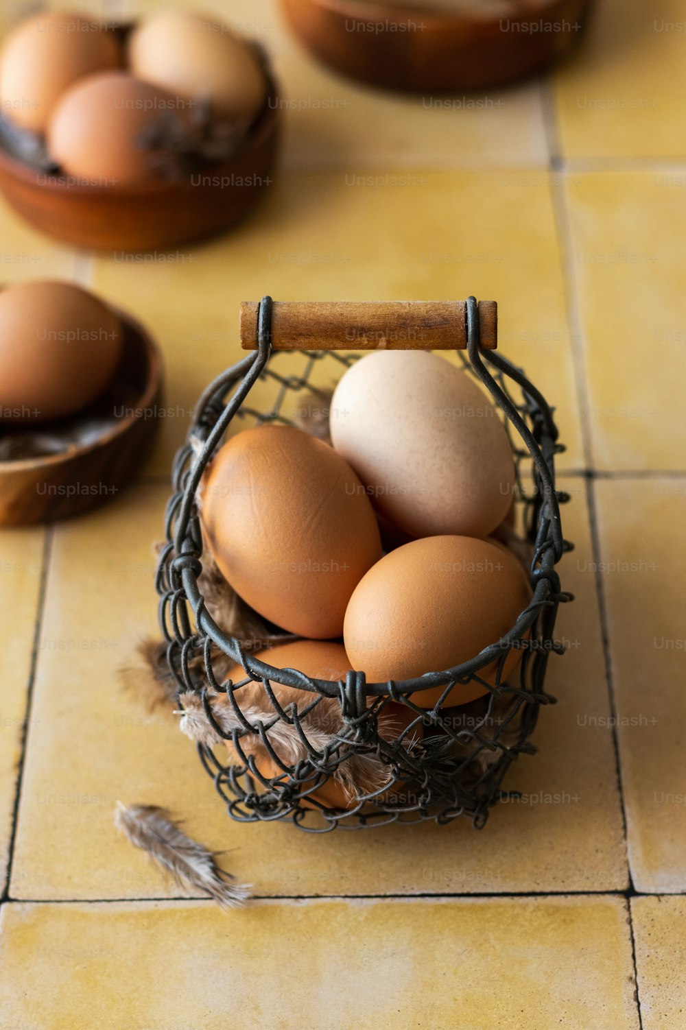 a basket of eggs sitting on top of a tiled floor