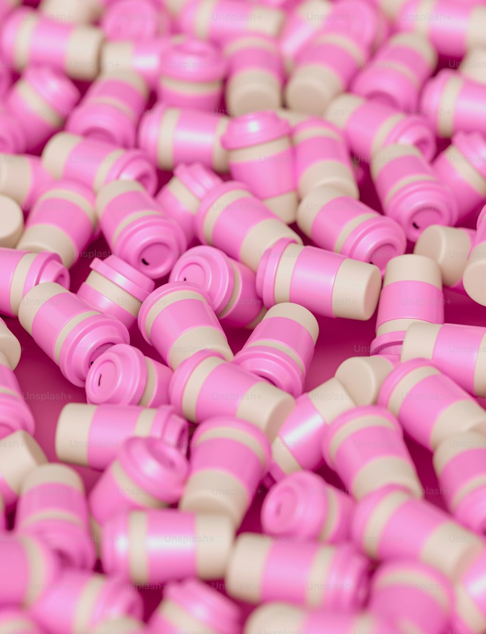 a bunch of pink and beige plastic beads