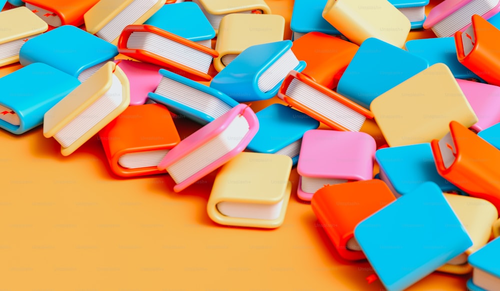 a pile of colorful books sitting on top of a table