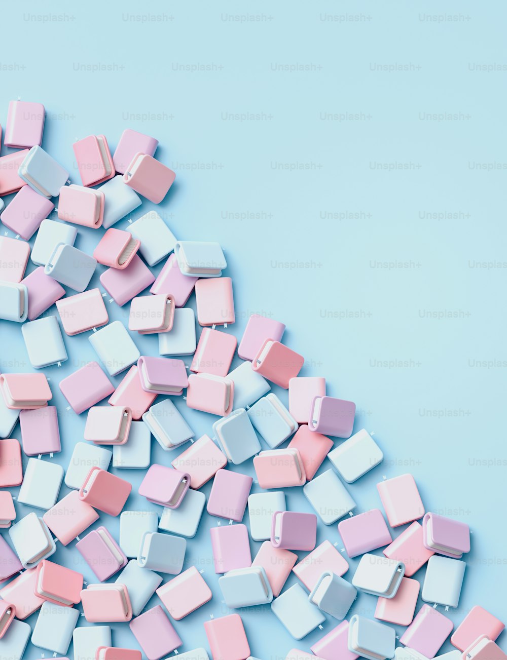 a pile of pastel colored cubes on a blue background