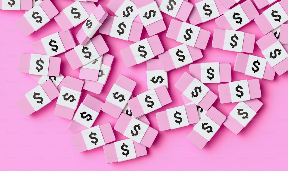 a pile of pink blocks with dollar signs on them